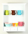 Kitchen utensils on beautiful white shelves