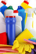 Different kinds of house cleaners and colorful sponges, gloves
