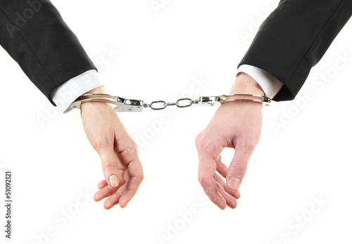 Photo: Man and woman hands and breaking handcuffs isolated Man and woman hands and breaking handcuffs isolated