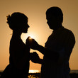 Photo: Sillhouette of loving couple at sunset Sillhouette of loving couple at sunset