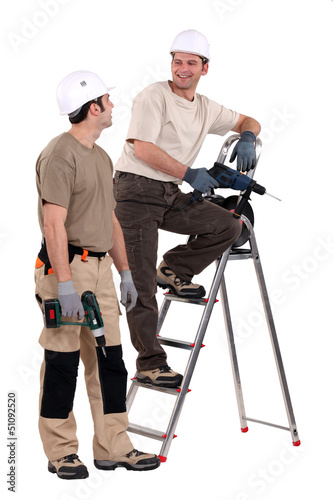 Photo: Two handymen at work. Two handymen at work.