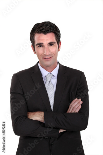 Photo: Portrait of a businessman with his arms crossed Portrait of a businessman with his arms crossed