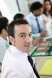 Photo: Man in meeting discussing a new housing estate Man in meeting discussing a new housing estate