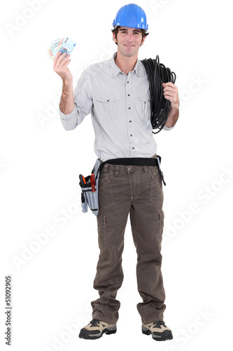 Photo: An electrician with plenty of cash. An electrician with plenty of cash.