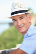 Older man in a straw panama hat