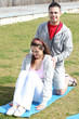 Photo: Couple exercising in the park Couple exercising in the park