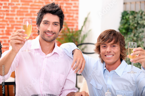Photo: Men drinking champagne in a bar Men drinking champagne in a bar