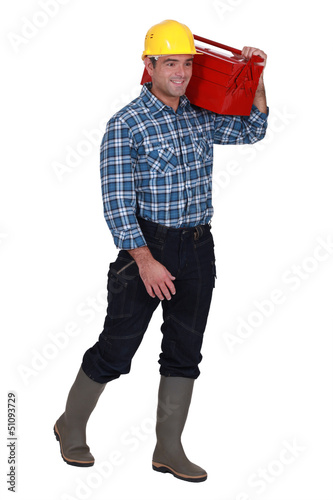 Photo: Tradesman carrying his toolbox Tradesman carrying his toolbox