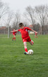 boy  kicking football