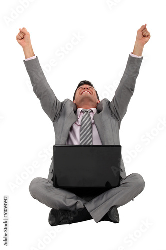 Photo: Happy worker in front of computer Happy worker in front of computer