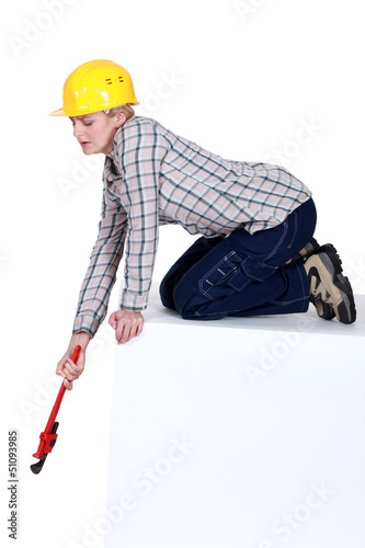 Photo: Working with a spanner Working with a spanner