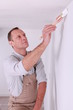 Painter painting wall