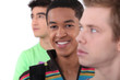 Young man surrounded by his peers