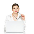 Thinking woman with laptop in white shirt