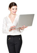 smiling woman holds laptop on hands