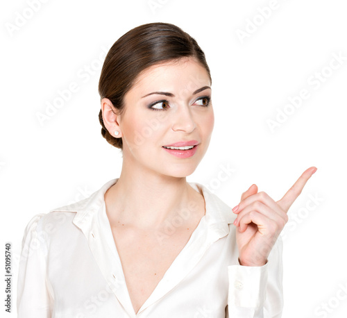 Photo: woman points to the side in white shirt woman points to the side in white shirt