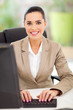 female secretary in office typing