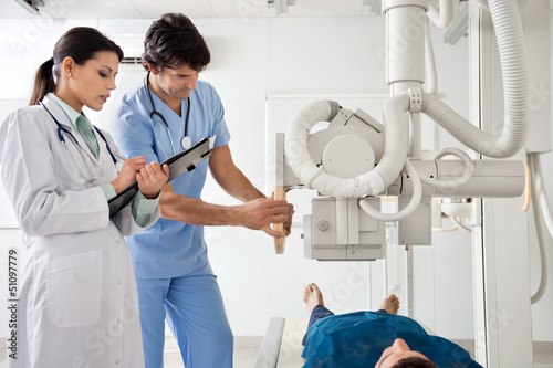 Photo: Radiologists Performing X-ray On Patient Radiologists Performing X-ray On Patient