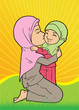 Muslim woman holding and kissing daughter