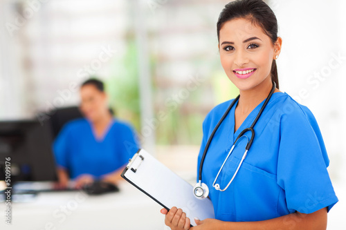 Photo: intern nurse holding a clipboard intern nurse holding a clipboard