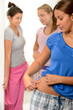 Teenager girl pinching her weight problems