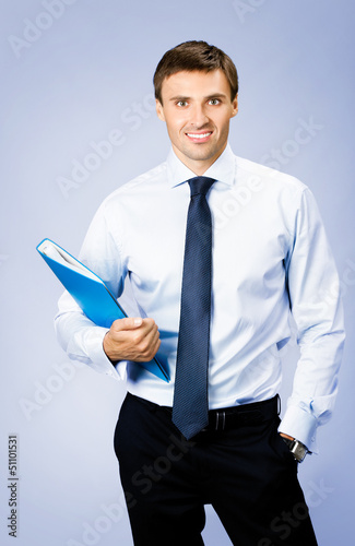 Photo: Business man with folder, on violet Business man with folder, on violet