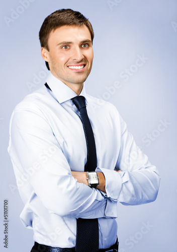 Photo: Portrait of businessman, over violet Portrait of businessman, over violet