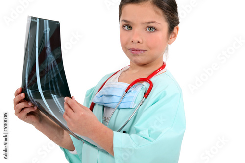 Photo: Young girl pretending to be a radiologist Young girl pretending to be a radiologist