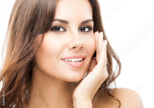 Photo: Woman touching skin or applying cream, isolated Woman touching skin or applying cream, isolated
