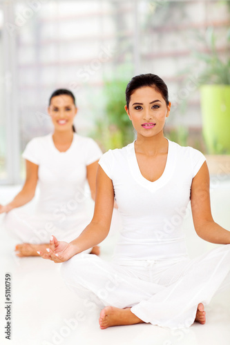Photo: attractive young women meditating attractive young women meditating