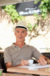 Elderly man drinking coffee