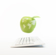 Illustration: Computer and an apple with the world map Computer and an apple with the world map