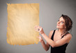 Young girl presenting old paper copy space