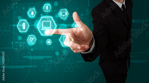 Photo: Businessman pressing virtual media type of buttons Businessman pressing virtual media type of buttons
