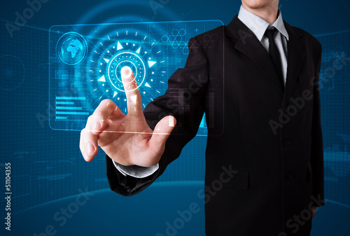 Photo: Businessman pressing high tech type of modern buttons Businessman pressing high tech type of modern buttons