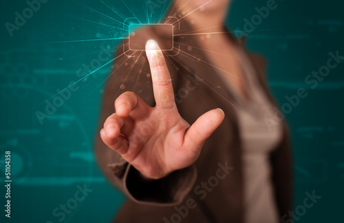 Photo: Woman pressing high tech type of modern buttons Woman pressing high tech type of modern buttons