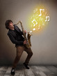 Handsome musician playing on saxophone with musical notes
