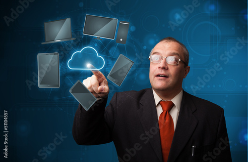 Photo: Businessman touching high technology cloud service Businessman touching high technology cloud service