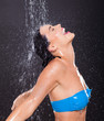 fun woman with water pouring on her