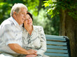 Senior couple in headset together, outdoors