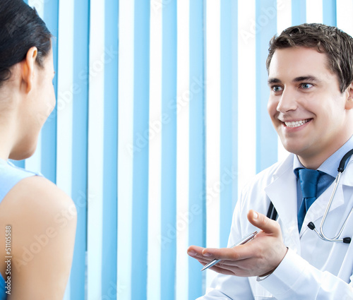 Photo: Portrait of smiling doctor and female patient Portrait of smiling doctor and female patient