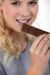 Photo: Woman eating chocolate Woman eating chocolate
