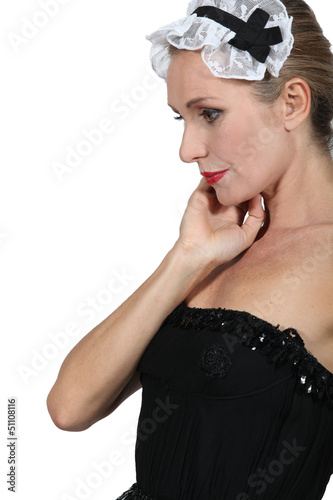 Photo: Woman dressed as a maid Woman dressed as a maid