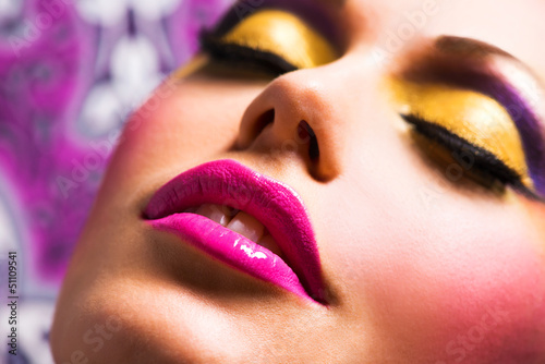 Photo: Beautiful face of a woman with pink lips Beautiful face of a woman with pink lips