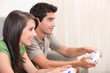 portrait of teenagers playing video game