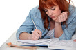 Young woman completing her homework