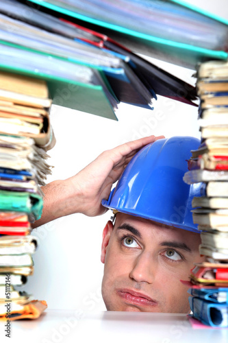 Photo: craftsman overwhelmed with paper work craftsman overwhelmed with paper work
