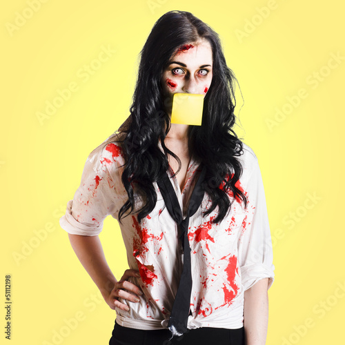 Photo: Deceased business woman with memo message on face Deceased business woman with memo message on face