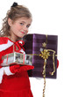 Girl dressed as Santa Claus with gifts