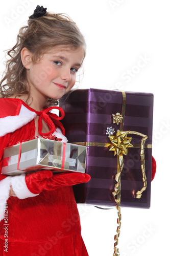 Photo: Girl dressed as Santa Claus with gifts Girl dressed as Santa Claus with gifts